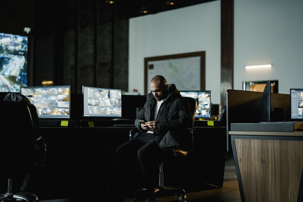 Security monitoring station reviewing recorded events